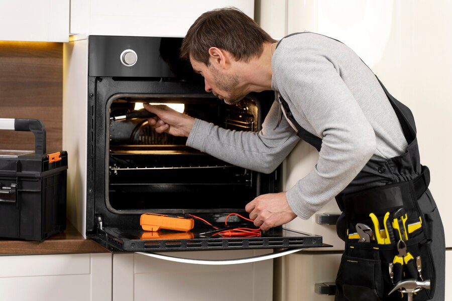 A man is putting something in the oven